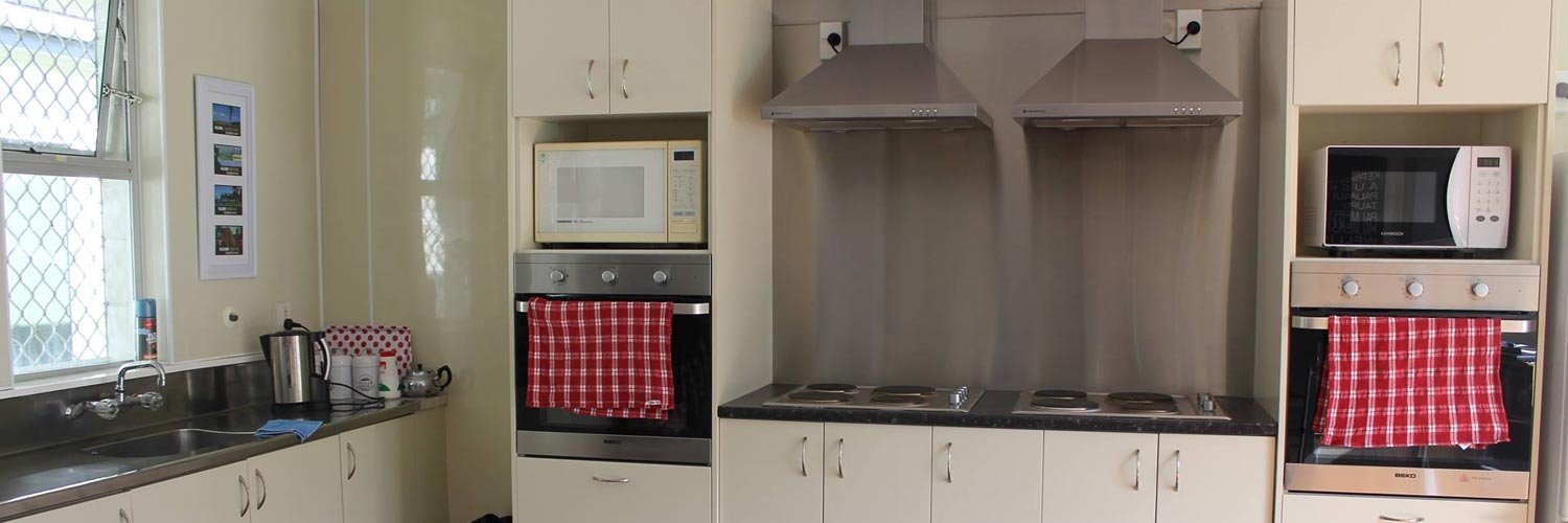 communal full-equipped kitchen for guests use